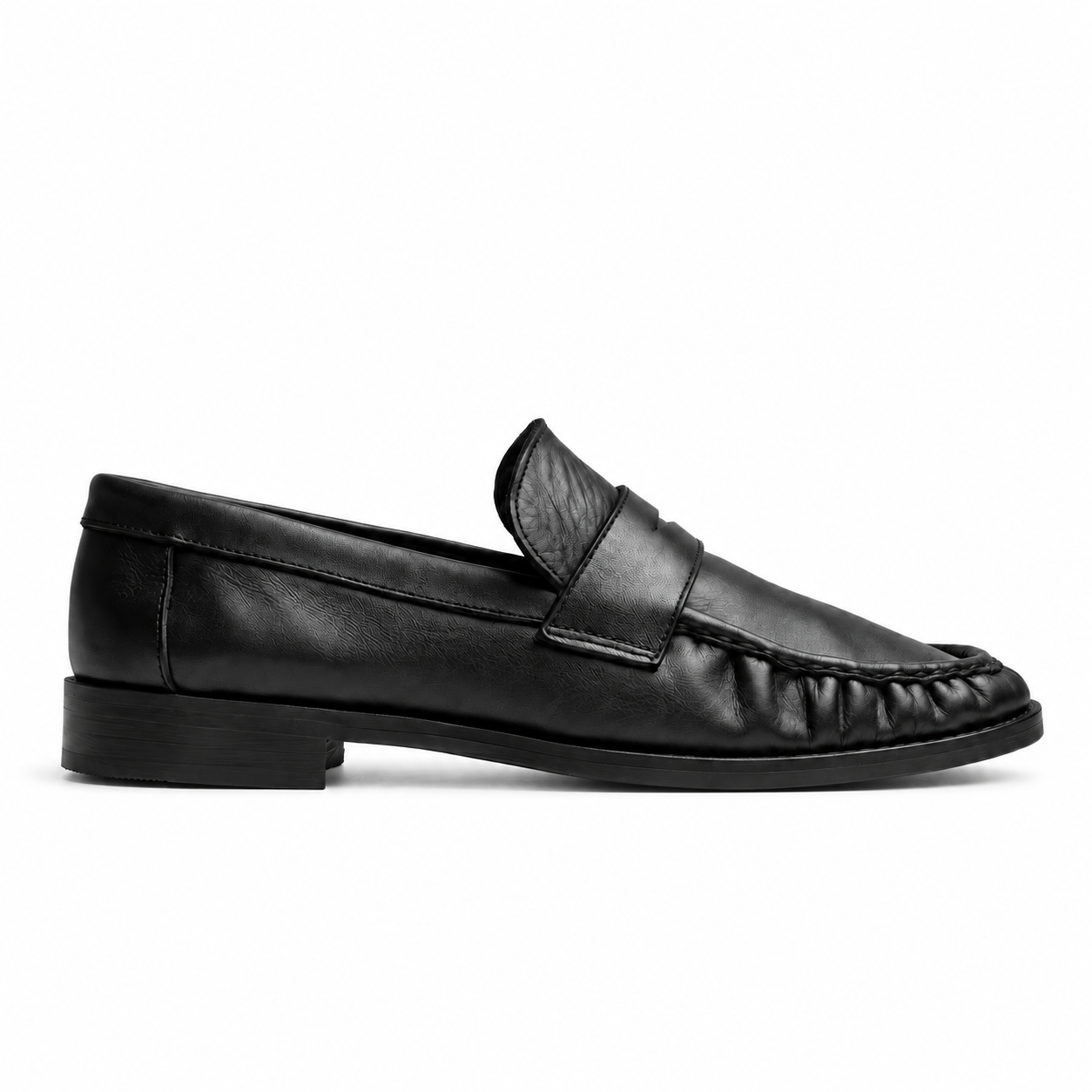 The Proper Moccasin in Obsidian Black calf leather, seen in profile.